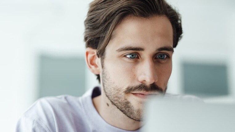 Man looking on his laptop