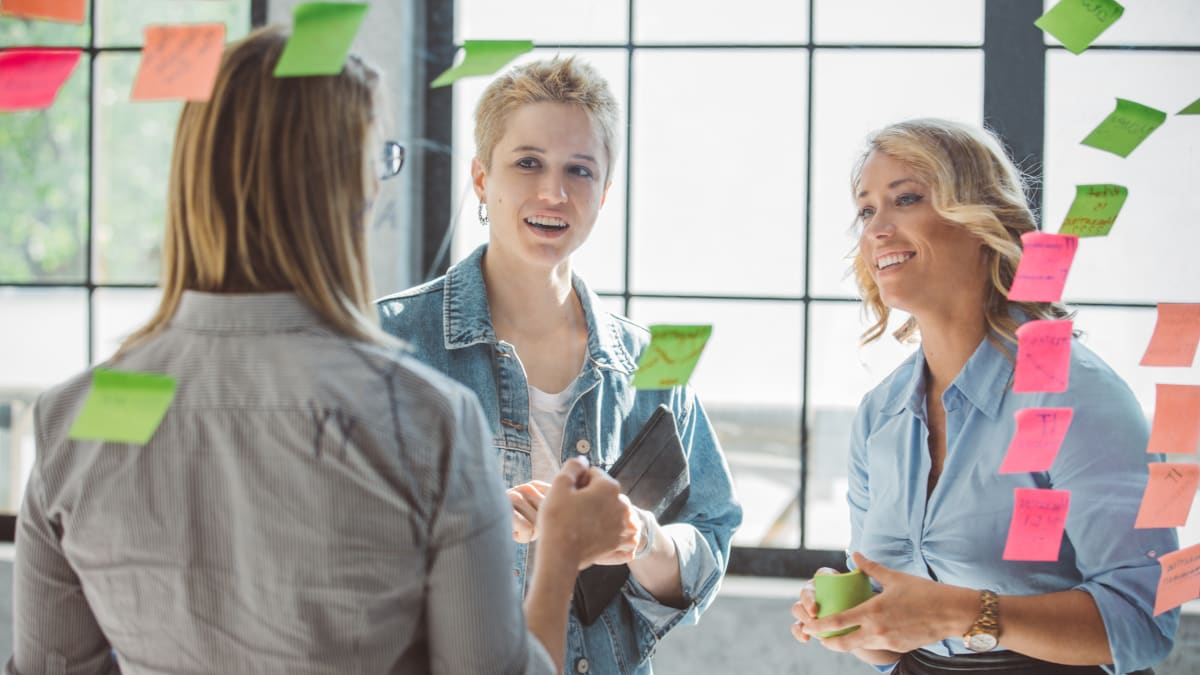 workers discussing marketing trends