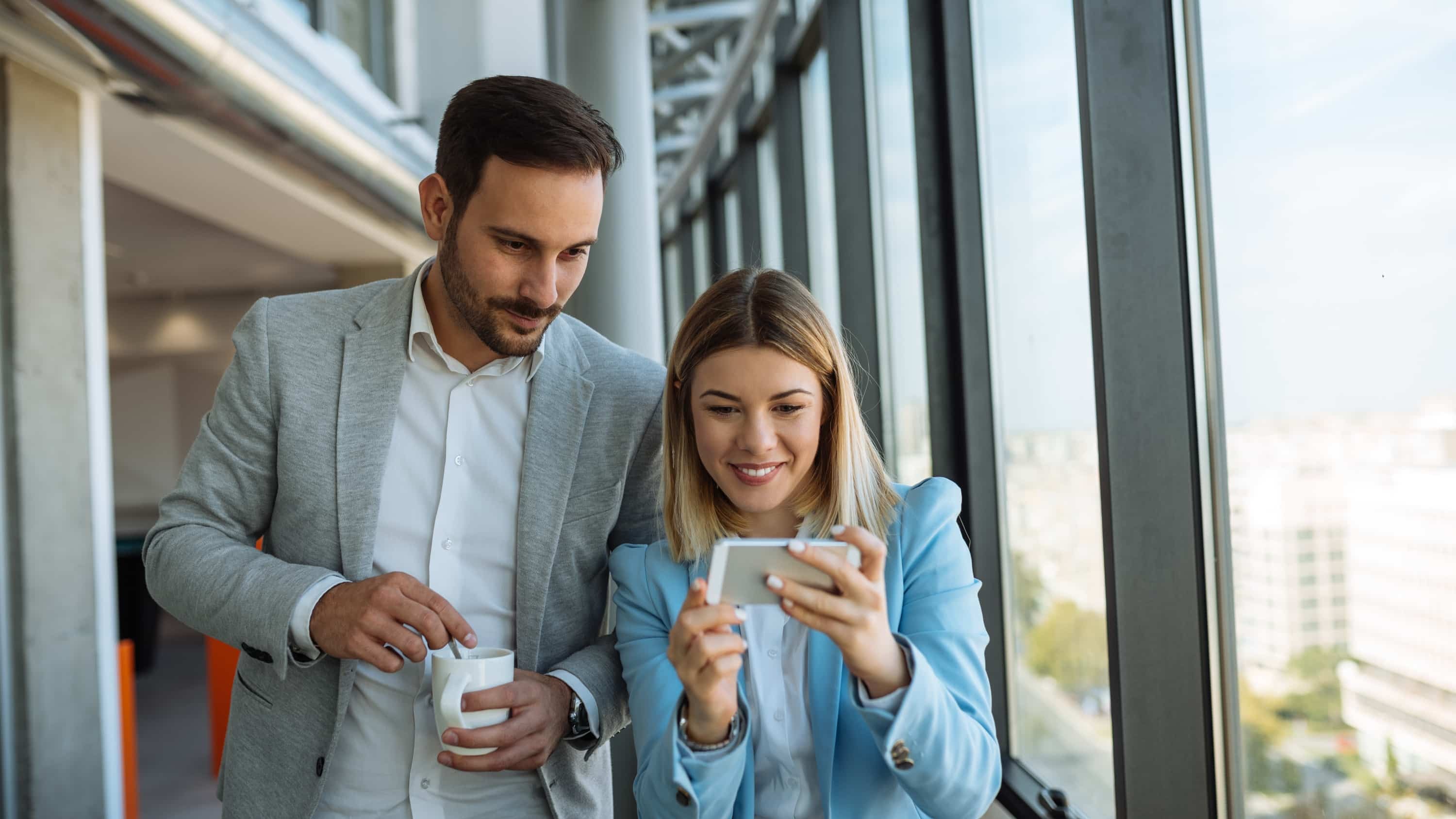 Colleagues looking at a B2B facebook page