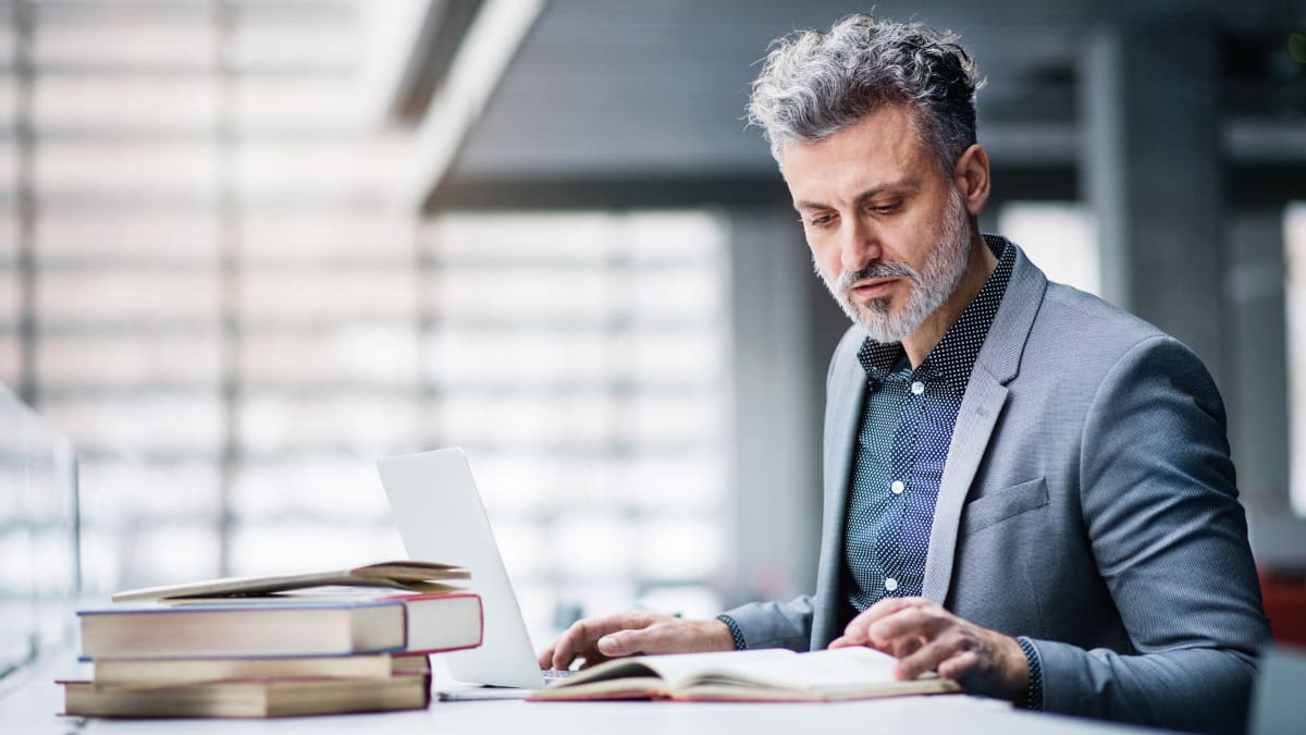 man reads books